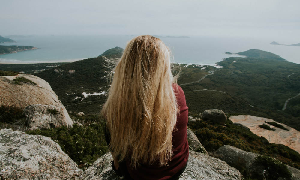girl looking over coastline